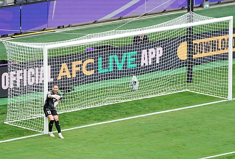 Uzbekistan's goalkeeper Zarina Saidova gestures during the Women's Asia Cup soccer match between North Korea and Uzbekistan in Sydney.