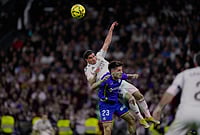 Real Madrid 0-1 Getafe La Liga 2025-26: Los Blancos Drop Points Again To Hand Barcelona The Lead | Photo: AP/Manu Fernandez : Getafe's Adrian Liso jumps for the ball against Real Madrid's Brahim Diaz during a Spanish La Liga soccer match between Real Madrid and Getafe in Madrid, Spain.
