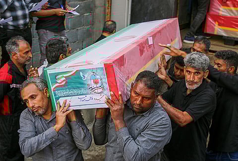 A coffin is carried during the funeral of mostly children killed in what Iranian officials said was an Israeli-U.S. strike Feb. 28 at a girls' elementary school in Minab, Iran.