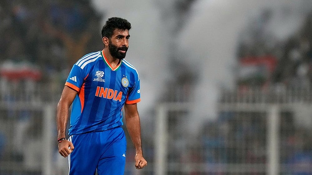 India's Jasprit Bumrah celebrates the wicket of West Indies' Roston Chase during the T20 World Cup cricket match between India and West Indies in Kolkata. - | Photo: AP/Bikas Das