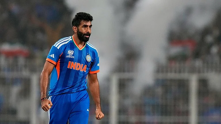 India's Jasprit Bumrah celebrates the wicket of West Indies' Roston Chase during the T20 World Cup cricket match between India and West Indies in Kolkata. - | Photo: AP/Bikas Das