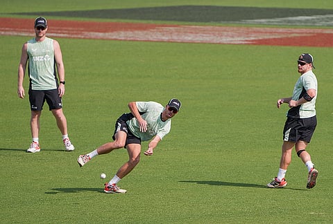 New Zealand's captain Mitchell Santner with teammates James Neesham and Glenn Phillips during a training session ahead of the ICC Men's T20 World Cup 2026 first semifinal cricket match between New Zealand and South Africa, at Eden Gardens, in Kolkata.