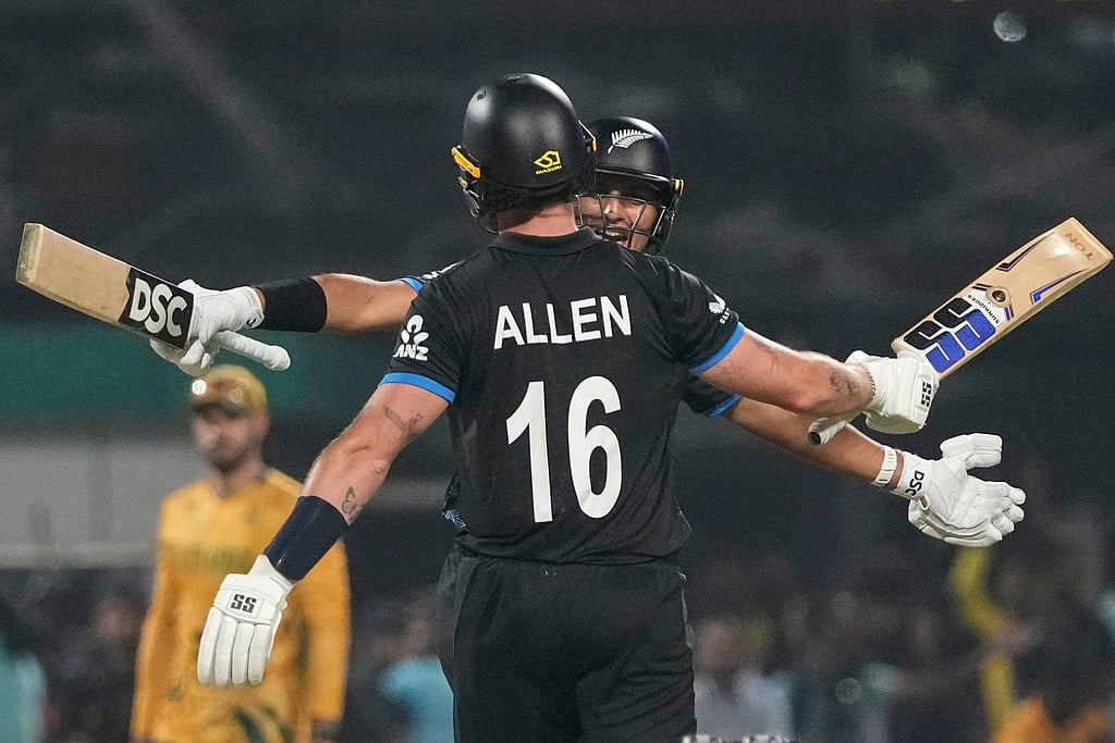New Zealand's Rachin Ravindra with his batting partner Finn Allen, celebrates after winning against South Africa during the first T20 World Cup cricket semifinal match in Kolkata. - | Photo: AP/Anupam Nath