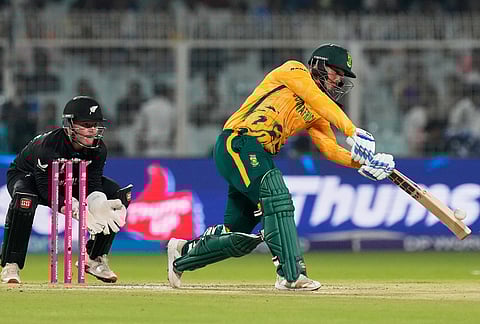 South Africa's Quinton de Kock plays a shot during the first T20 World Cup cricket semifinal match between New Zealand and South Africa in Kolkata.