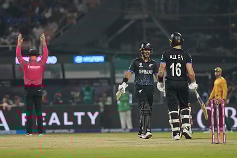 New Zealand's Rachin Ravindra celebrates with his batting partner New Zealand's Finn Allen after hitting a six during the first T20 World Cup cricket semifinal match between New Zealand and South Africa in Kolkata.