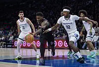 | Photo: AP/Abbie Parr : Minnesota Timberwolves guard Anthony Edwards, middle, reaches for the ball against Memphis Grizzlies forward Olivier-Maxence Prosper (18) during the first half of an NBA basketball game in Minneapolis. 