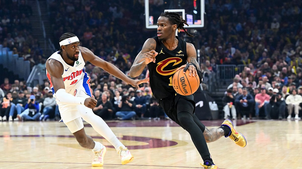 Keon Ellis #14 of the Cleveland Cavaliers brings the ball up court around Caris LeVert #8 of the Detroit Pistons d3q at Rocket Arena on March 03, 2026 in Cleveland, Ohio. The Cavaliers defeated the Pistons 113-109. - null