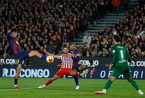 Barcelona's Marc Bernal scores his side's third goal during the Copa del Rey semifinal second leg soccer match between Barcelona and Atletico Madrid in Barcelona, Spain.