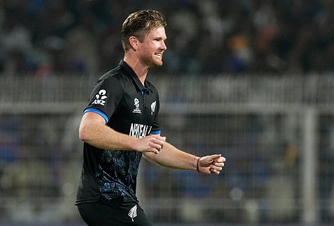 New Zealand's James Neesham celebrates the wicket of South Africa's Dewald Brevis during the first T20 World Cup cricket semifinal match between New Zealand and South Africa in Kolkata.