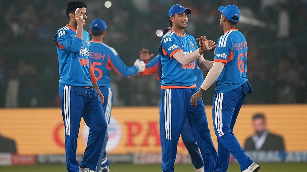 India's captain Suryakumar Yadav, right, with teammates celebrates after winning the first T20 International cricket match between India and South Africa in Cuttack. - | Photo: AP/Rafiq Maqbool