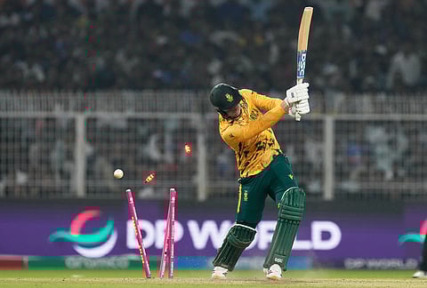 South Africa's Corbin Bosch is bowled out by New Zealand's Matt Henry during the first T20 World Cup cricket semifinal match between New Zealand and South Africa in Kolkata.