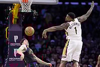 |  Photo: AP/Mark J. Terrill : New Orleans Pelicans forward Zion Williamson, right, looses control of the ball as Los Angeles Lakers guard Austin Reaves defends during the second half of an NBA basketball game in Los Angeles. 