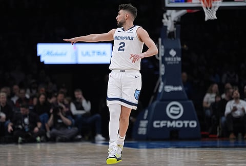 Memphis Grizzlies guard Ty Jerome (2) reacts after making a 3-point shot during the second half of an NBA basketball game against the Minnesota Timberwolves, in Minneapolis.