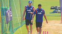 India Vs England, T20 World Cup Semi-Final: Varun Chakravarthy Toils Hard To Regain His Magic Ahead Of The Big Clash AP Photo/Rafiq Maqbool : India's bowling coach Morne Morkel, left, and India's Varun Chakravarthy attends a training session ahead of their T20 World Cup cricket semi final match against England in Mumbai, Wednesday, March 4, 2026