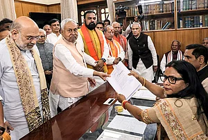| Photo: Handout via PTI : Bihar Chief Minister Nitish Kumar in the presence of Union Home Minister Amit Shah files nomination papers for the Rajya Sabha polls, in Patna. State Deputy Chief Ministers Samrat Choudhary and Vijay Kumar Sinha also seen.