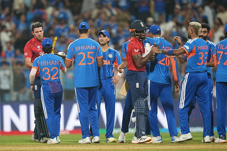 Players greet each other at the end of the T20 World Cup cricket semi-final match between India and England in Mumbai, India. - | Photo: AP/Rafiq Maqbool