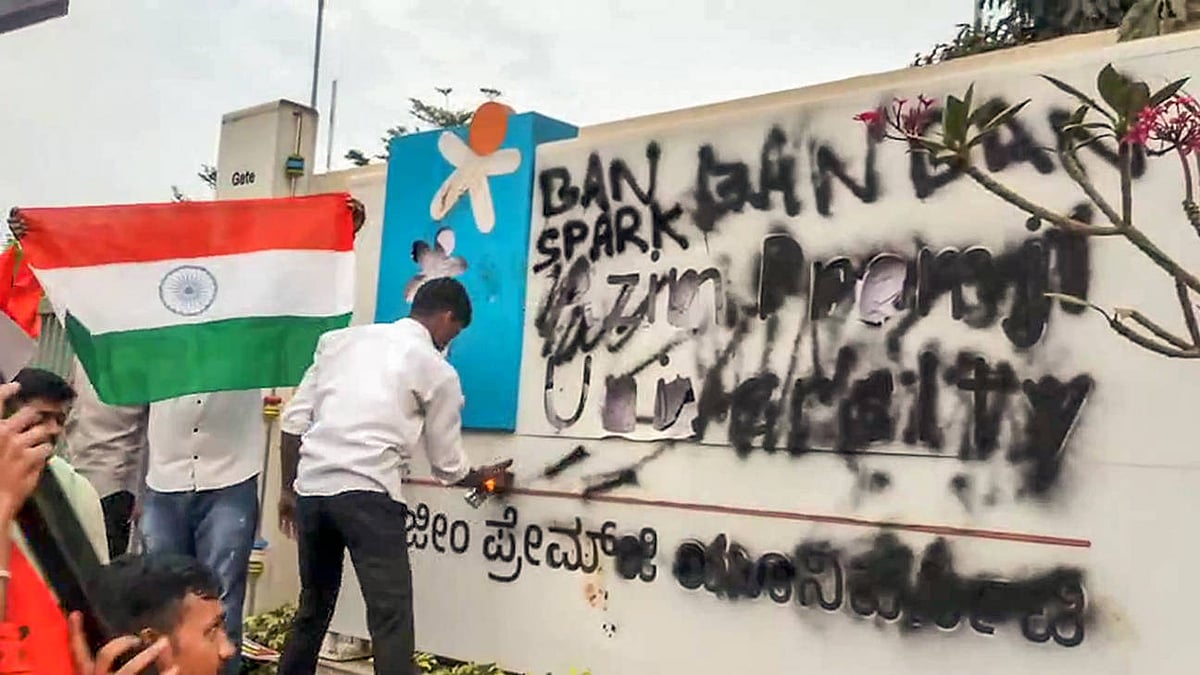 Students affiliated with ABVP stage a protest alleging an anti-Army programme at Azim Premji University Anekal Karnataka , Feb 25 (ANI): Students affiliated with ABVP smeared black ink on the University s billboard during a protest alleging an anti-Army programme at Azim Premji University, in Anekal on Tuesday. - null