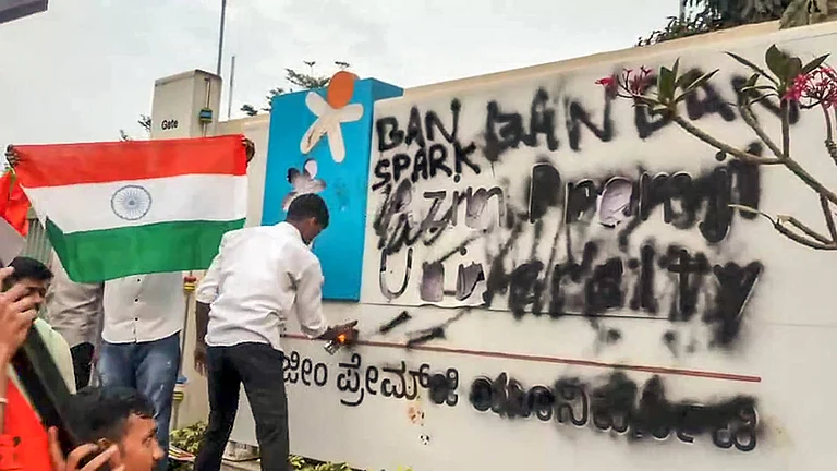 Students affiliated with ABVP stage a protest alleging an anti-Army programme at Azim Premji University Anekal Karnataka , Feb 25 (ANI): Students affiliated with ABVP smeared black ink on the University s billboard during a protest alleging an anti-Army programme at Azim Premji University, in Anekal on Tuesday. - null