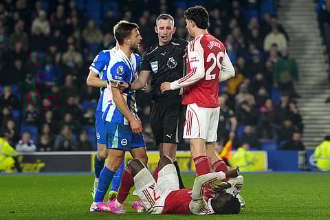 Brighton's Joel Veltman, leaft, and Arsenal's Kai Havertz argue during the Premier League soccer match between Brighton and Arsenal in Brighton, England.