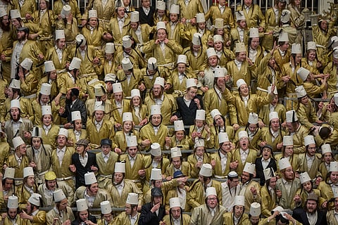 Ultra-Orthodox Jewish men celebrate the festival of Purim in Jerusalem, amid the war with Iran.
