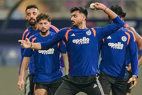 India's Axar Patel, front, and others during a training session ahead of the ICC Men's T20 World Cup 2026 semi-final cricket match between India and England, in Mumbai.