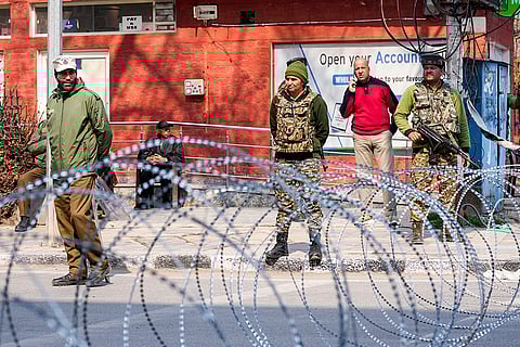 Security personnel stand guard after partial restrictions on the movement of people remained in force as a precautionary measure in view of the spontaneous protests broke out across Kashmir against the killing of Iran's supreme leader Ayatollah Ali Khamenei, in Srinagar.