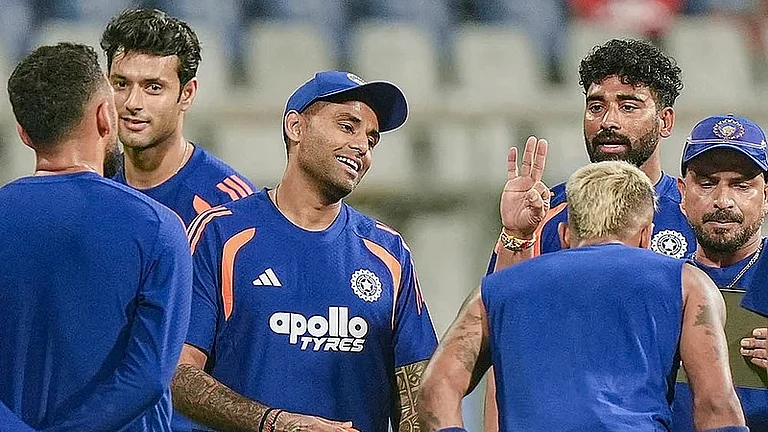 India's captain Suryakumar Yadav, centre, with teammates during a training session ahead of the ICC T20 World Cup 2026 semi-final against England in Mumbai. - PTI