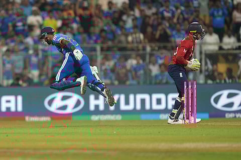 India's Hardik Pandya leaps as he is run out during the T20 World Cup cricket semi-final match between India and England in Mumbai, India, Thursday, March 5, 2026. (AP Photo/Rafiq Maqbool)