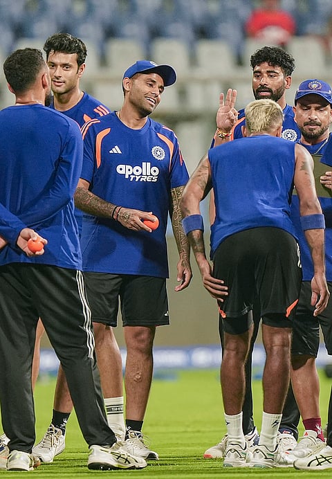 India's captain Suryakumar Yadav, center, with teammates during a training session ahead of the ICC Men's T20 World Cup 2026 semi-final cricket match between India and England, in Mumbai.