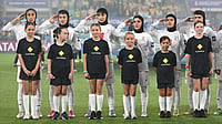 (Dave Hunt/AAPImage via AP) : Iran players react during their national anthem ahead of the Women's Asia Cup soccer match between Australia and Iran in Robina, Australia, Thursday, March 5, 2026. 