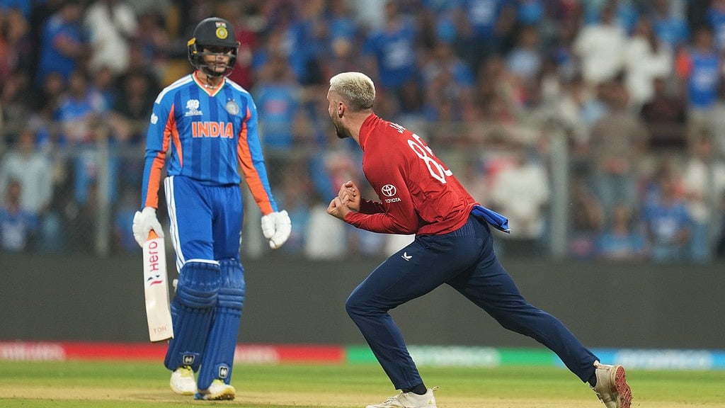 England's Will Jacks, right, celebrates the dismissal of India's Abhishek Sharma, left, during the T20 World Cup cricket semi-final match between India and England in Mumbai, India, Thursday, March 5, 2026. - AP Photo/Rafiq Maqbool