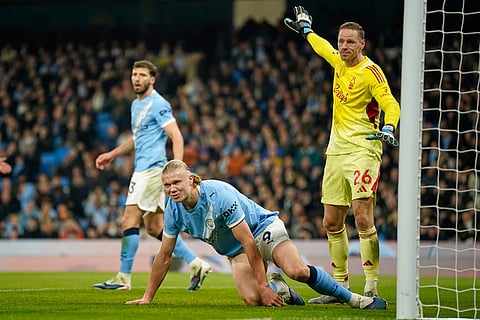 Manchester City's Erling Haaland reacts after missing a chance during the English Premier League soccer match between Manchester City and Nottingham Forest in Manchester, England.