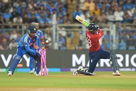 England's Tom Banton is bowled out by India's Axar Patel during the T20 World Cup cricket semi-final match between India and England in Mumbai, India.