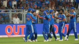 AP Photo/Rafiq Maqbool : Indian players celebrate the dismissal of England's Will Jacks during the T20 World Cup cricket semi-final match between India and England in Mumbai, India, Thursday, March 5, 2026.