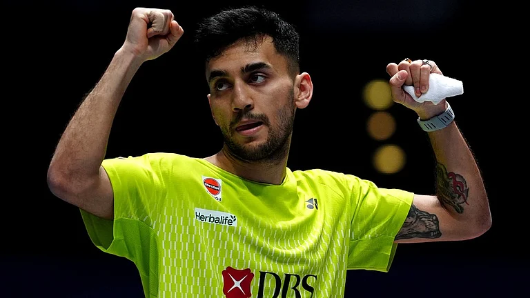 India's Lakshya Sen celebrates winning his men's singles match against China's Shi Yuqi on day one of the All England Open Badminton Championships in Birmingham. - Bradley Collyer/PA via AP