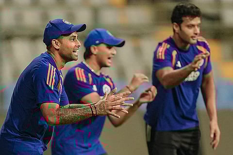 India's captain Suryakumar Yadav, left, with teammates during a training session ahead of the ICC Men's T20 World Cup 2026 semi-final cricket match between India and England, in Mumbai.