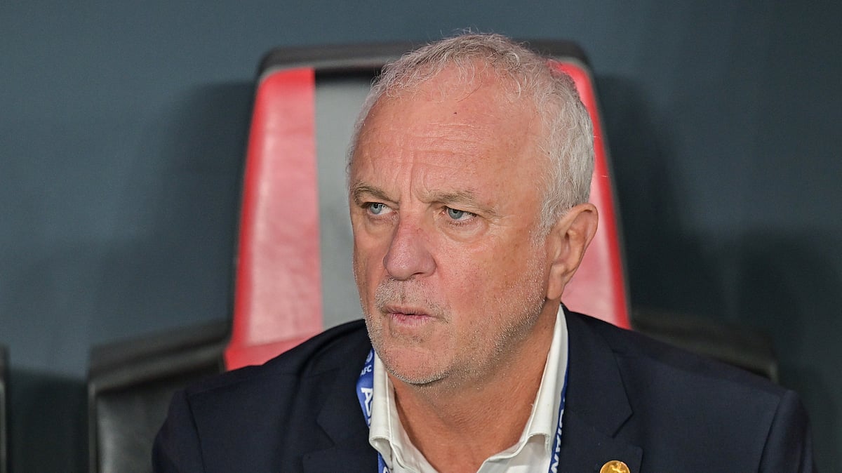 FILE- Iraqi's head coach Graham Arnold sits on the bench at the start of the 2026 World Cup play off first leg soccer match between UAE and Iraq in Abu Dhabi, United Arab Emirates, Friday, Nov. 14, 2025.  - (AP Photo/Walid Ibrahim, File)