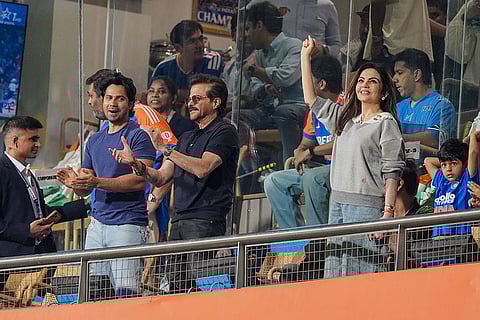 Bollywood actors Anil Kapoor, Varun Dhawan, left, and Reliance Foundation chairperson Nita Ambani, right, during the ICC Men's T20 World Cup 2026 second semifinal cricket match between India and England, at the Wankhede Stadium, in Mumbai, Maharashtra.
