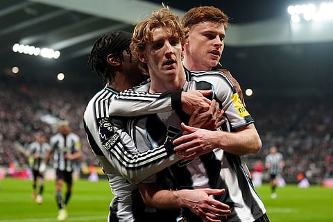 Newcastle United's Anthony Gordon, center, celebrates after scoring his sides first goal during their English Premier League soccer match against Manchester United in Newcastle, England.