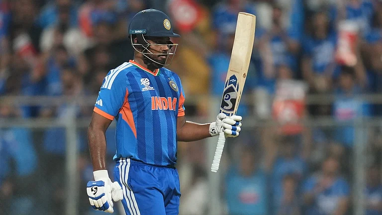 India's Sanju Samson celebrates after scoring fifty runs during the T20 World Cup cricket semi-final match between India and England in Mumbai, India, Thursday, March 5, 2026. - AP Photo/Rafiq Maqbool