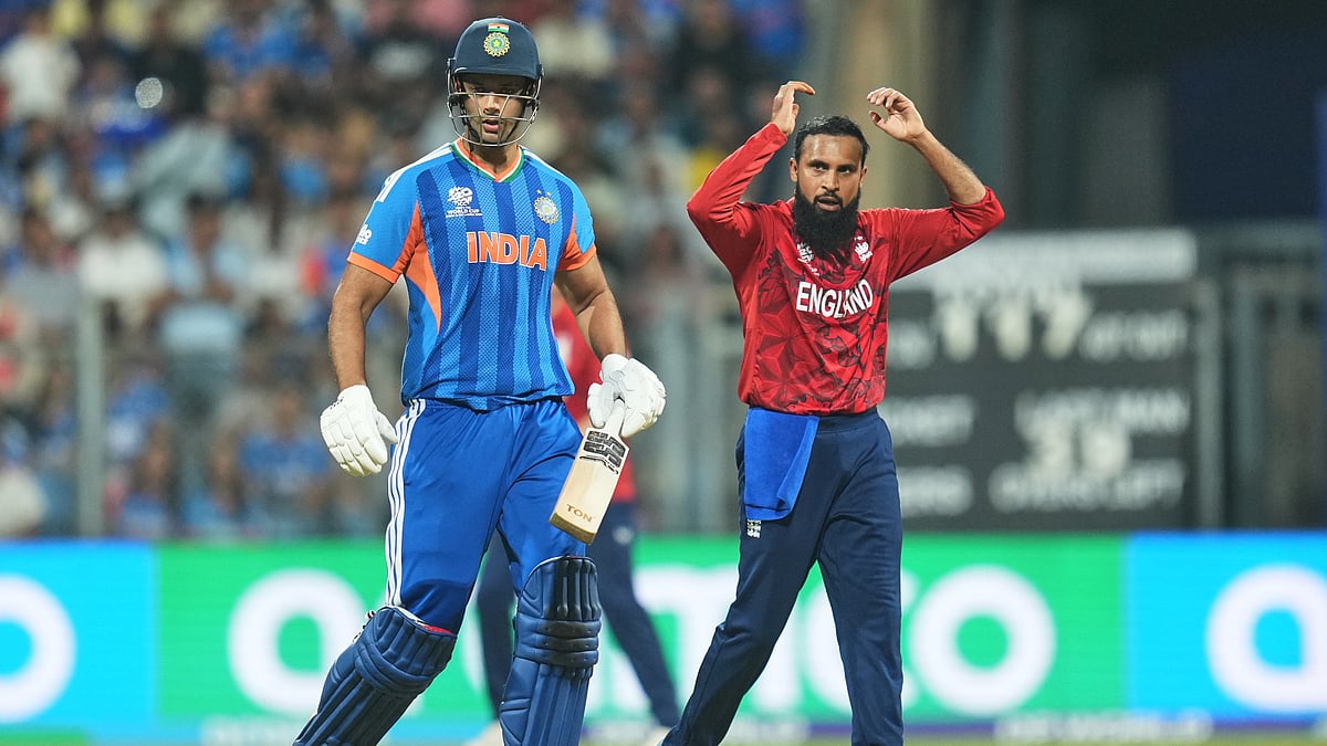 England's Adil Rashid, right, reacts after bowling a delivery to India's Shivam Dube, left, during the T20 World Cup cricket semi-final match between India and England in Mumbai, India, Thursday, March 5, 2026.  - (AP Photo/Rafiq Maqbool)