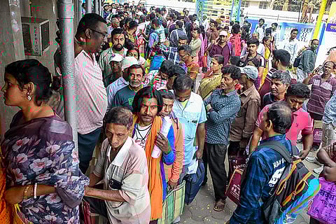 People, whose names have reportedly been left out in the post-SIR electoral rolls, wait to apply for inclusion of their names, at DM's office, in Nadia, West Bengal.