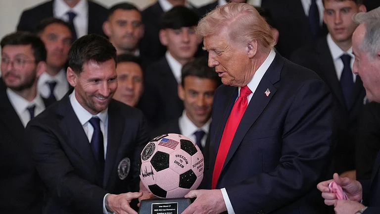 President Donald Trump receives a soccer ball trophy from Lionel Messi during an event to honor the 2025 Major League Soccer champions Inter Miami in the East Room of the White House, Thursday, March 5, 2026, in Washington. - AP/Julia Demaree Nikhinson