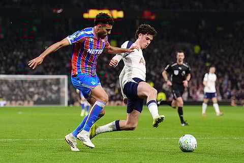 Crystal Palace's Chadi Riad, left, and Tottenham Hotspur's Archie Gray in action during the English Premier League soccer match between Tottenham Hotspur and Crystal Palace in London.
