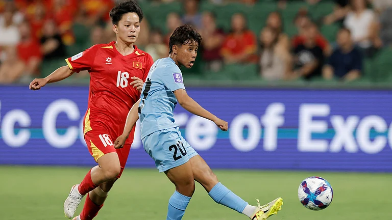 India's Sanfida Nongrum, right, scores her team's first goal as Vietnam's Cù Thị Huỳnh Như looks on during the Women's Asia Cup soccer match between India and Vietnam in Perth, Australia, Wednesday, March 4, 2026. - | Photo: AP/RICHARD WAINWRIGHT