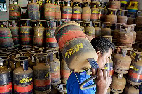 A worker carries an LPG cylinder, in Thane. Rumours about a shortage of petroleum products and liquefied petroleum gas (LPG) due to the ongoing West Asia conflict has triggered consumers to brace for the issue.