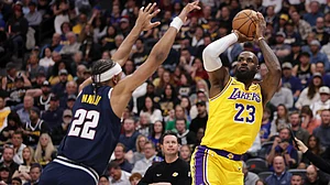 LeBron James became the NBA's all-time leader in career field goals made in the Los Angeles Lakers' 120-113 loss to the Denver Nuggets on Thursday.