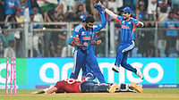 | Photo: AP/Rafiq Maqbool : India's Jasprit Bumrah, left, and teammates celebrate the run out of England's Jacob Bethell, on ground, during the T20 World Cup cricket semi-final match between India and England in Mumbai, India, Thursday, March 5, 2026.