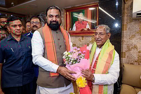 Bihar Deputy Chief Minister Samrat Choudhary congratulates BJP leader Nand Kishore Yadav after the latter was appointed as the new Governor of Nagaland, in Patna.