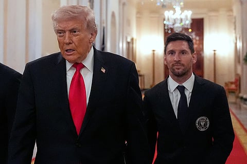 Lionel Messi arrives with President Donald Trump at an event to honor the 2025 Major League Soccer champions Inter Miami CF in the East Room of the White House in Washington.
